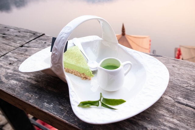 slice of cake and green kratom drink