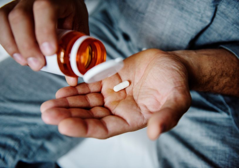 Man taking medicaation